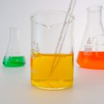 close up view of colorful liquids in laboratory glasswares