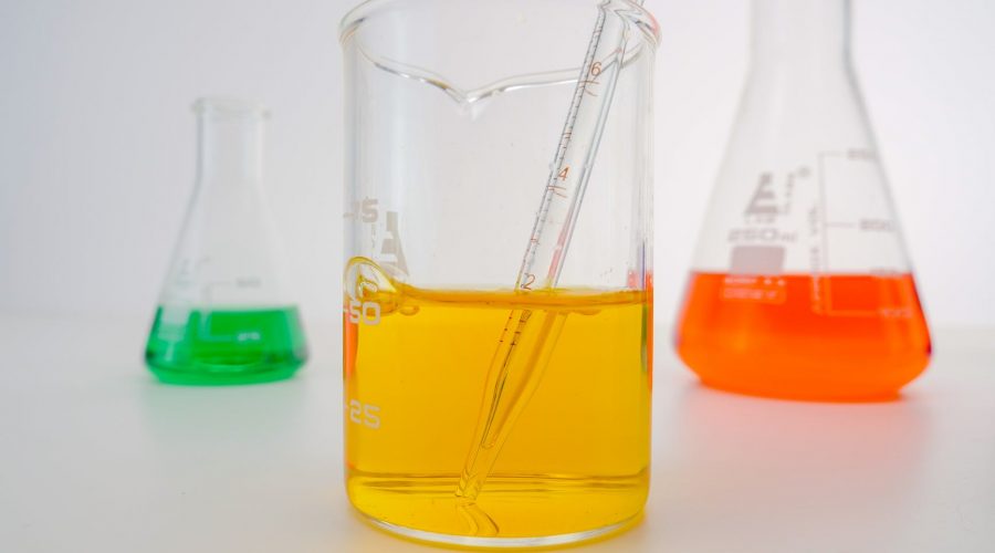 close up view of colorful liquids in laboratory glasswares